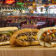 Portillo's Italian beef sandwiches on cutting board